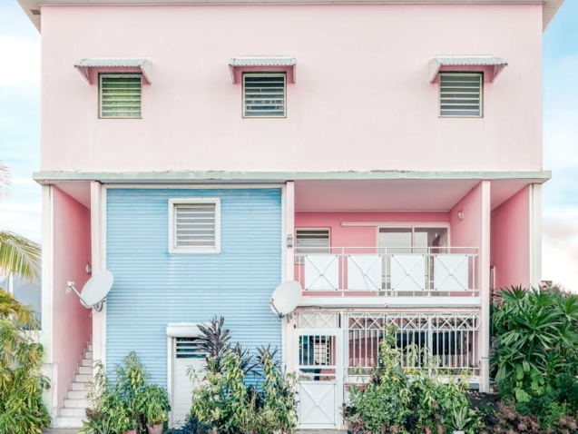 facade of a colorful house next to the street